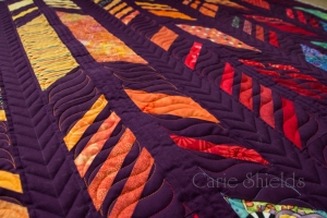 Quilted feather quilt close up